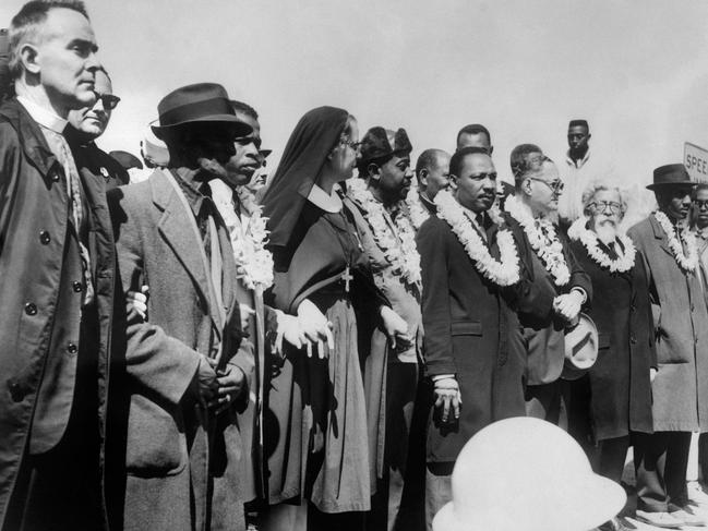 Dr Martin Luther King (5th R), civil rights activist Ralph Abernathy (5th L), John Lewis (3rd L), make their way from Selma to Montgomery in Alabama during a 1965 march. Picture: AFP