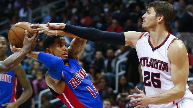 Detroit Pistons guard D.J. Augustin (14) is fouled by Atlanta Hawks guard Kyle Korver (26).