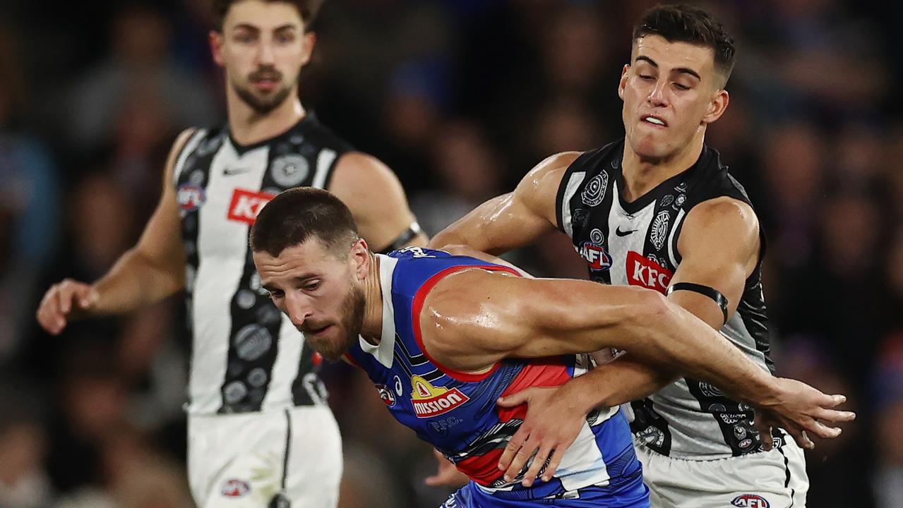 MELBOURNE - July 7 : AFL. Bulldog Marcus Bontempelli battles with Nick Daicos of the Magpies during the round 17 AFL match between Western Bulldogs and Collingwood at Marvel Stadium on July 7, 2023. Photo by Michael Klein.