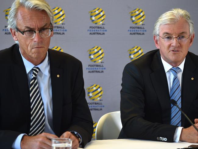 Football Federation Australia chairman Steven Lowy (R) and chief executive officer David Gallop (L) take part in a press conference at the federation's head office in Sydney on November 30, 2017. / AFP PHOTO / PETER PARKS / --IMAGE RESTRICTED TO EDITORIAL USE - STRICTLY NO COMMERCIAL USE--