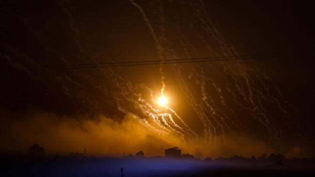 Smoke and flares dropped by Israeli forces over the Gaza Strip. Picture: AFP