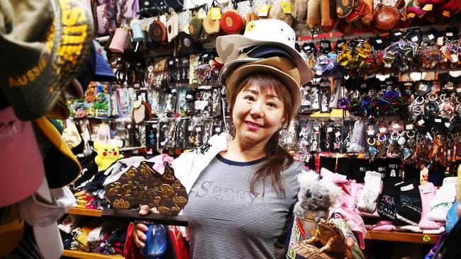 May Cui owns Cuili T-shirt and Souvenir shop in the night markets, selling all sorts of trinkets and wearables. PICTURE: BRENDAN RADKE