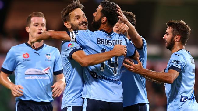 Milos Ninkovic and Alex Brosque of Sydney celebrate a goal.