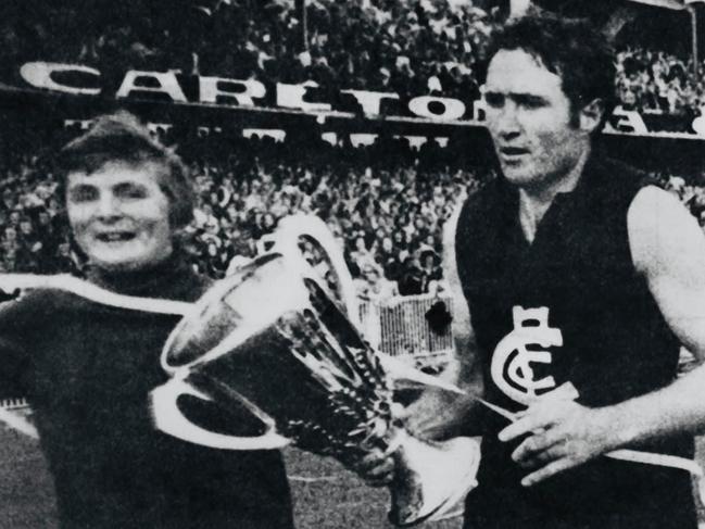 Macca, from Mount Waverley, with Carlton’s John Nicholls and the VFL premiership cup in 1972.