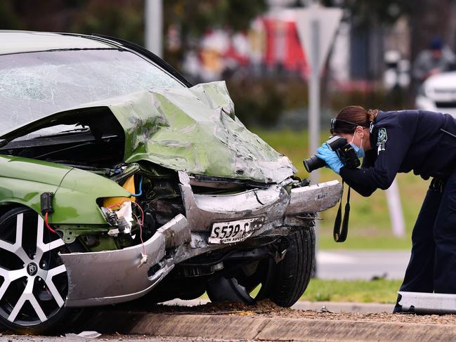 Police and crime scene investigators at the scene of a crash on Edinburgh Road and Sturton Road Edinburgh where a stolen green commodore hit a grey Mitsubishi Evo Friday August,20,2021.Picture Mark Brake