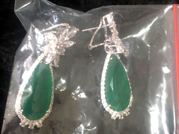 The St Kilda woman is accused of stealing these $550 earrings. 