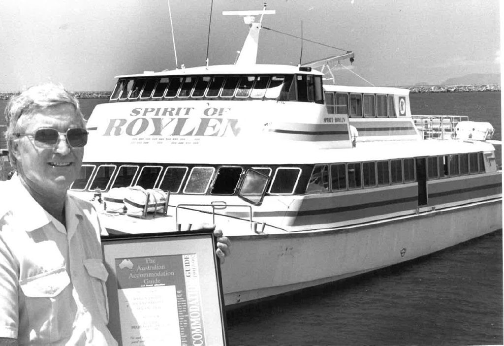 Roylen Cruises managing director Barry Dean in 1990 stands with an award at the front of the Spirit of Roylen Photo Daily Mercury Archives. Picture: Daily Mercury Archives