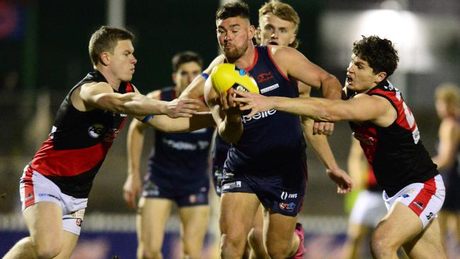 Norwood’s Mitch Grigg is gang-tackled against West Adelaide at The Parade on Friday night. Picture: Michael Marschall.