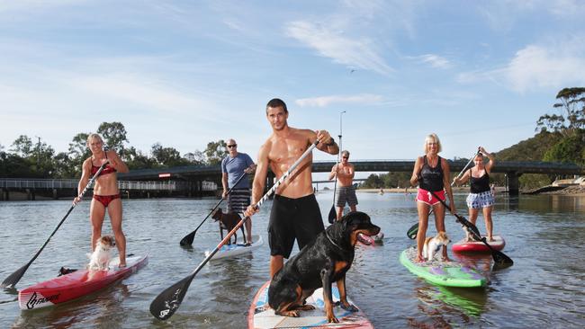 Currumbin paddleboarders (from left) Angela Jackson, Neil Pearson, Paul Jackson and dog Sup, Nigel Milnes, Hilzary Smith and Liz Milnes and their dogs. Photo: Tim Marsden