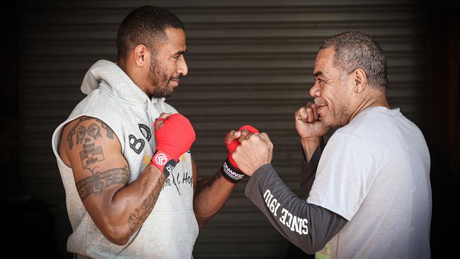 Rosemeadow boxer Renold Quinlan with his uncle and head trainer Lepani Wilson. Picture: Carmela Roche