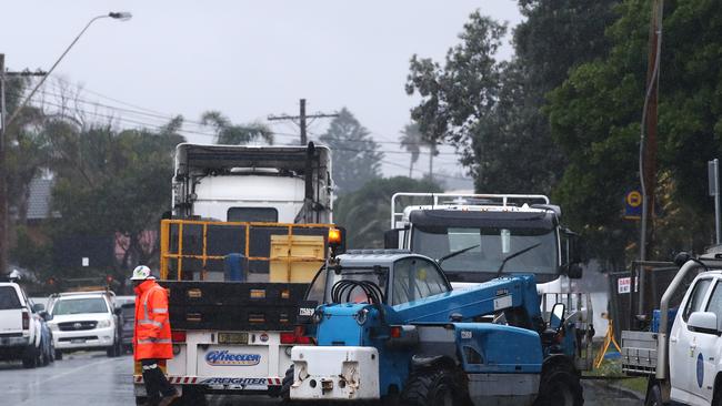 Earth moving and construction equipment arrive at Ocean View Drive that is closed to beach front residents and the public following damage to homes at Wamberal Beach. Picture: Cameron Spencer/Getty Images.