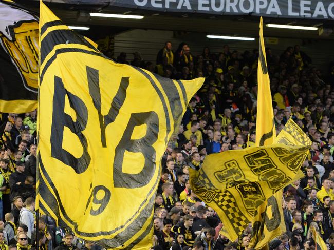 Borussia Dortmund fans. / AFP PHOTO / OLI SCARFF