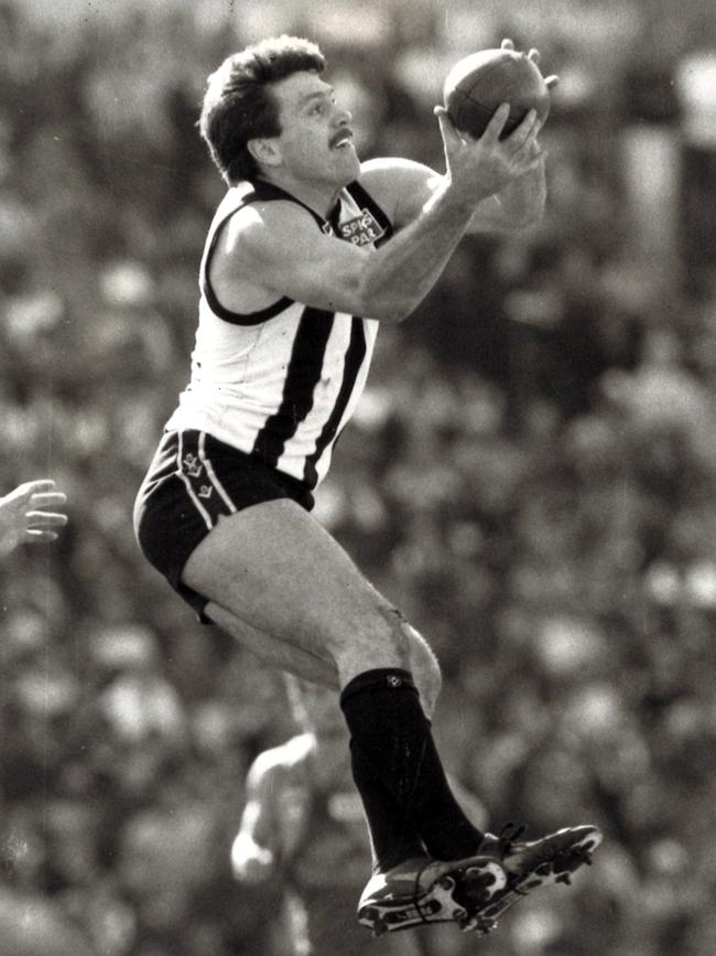 Brian Taylor flies during the Magpies’ drawn 1990 qualifying final.