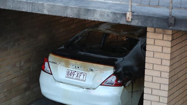 One of the vehicles damaged in the arson attack at Highgate Hill. Picture: Peter Wallis