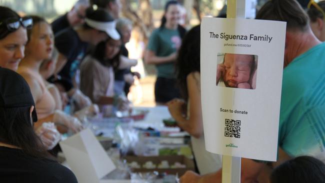 Dozens have descended on the Alice Springs baseball field on Friday, December 13 to attend a bake sale to raise funds for the Siguenza family, who were victims in a horrific home invasion in Larapinta on Wednesday, December 10, which required the newest member of the family, a two-month-old little girl, to be airlifted to Adelaide Women and Childrenâs hospital for treatment. Picture: Gera Kazakov