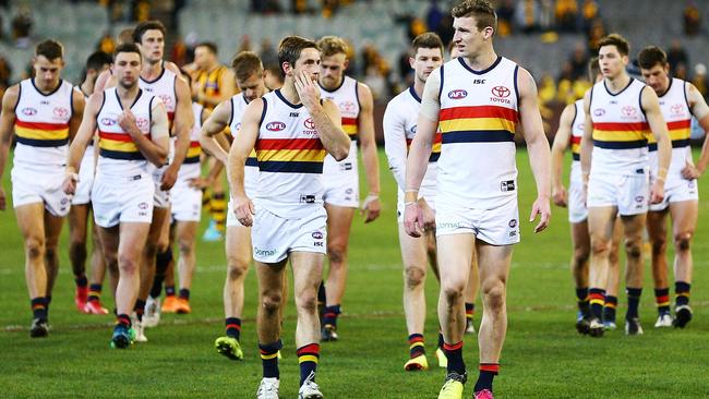 Josh Jenkins leads the way as a dejected Crows leaves the field after its thumping from Hawthorn. Picture: Michael Dodge/Getty Images