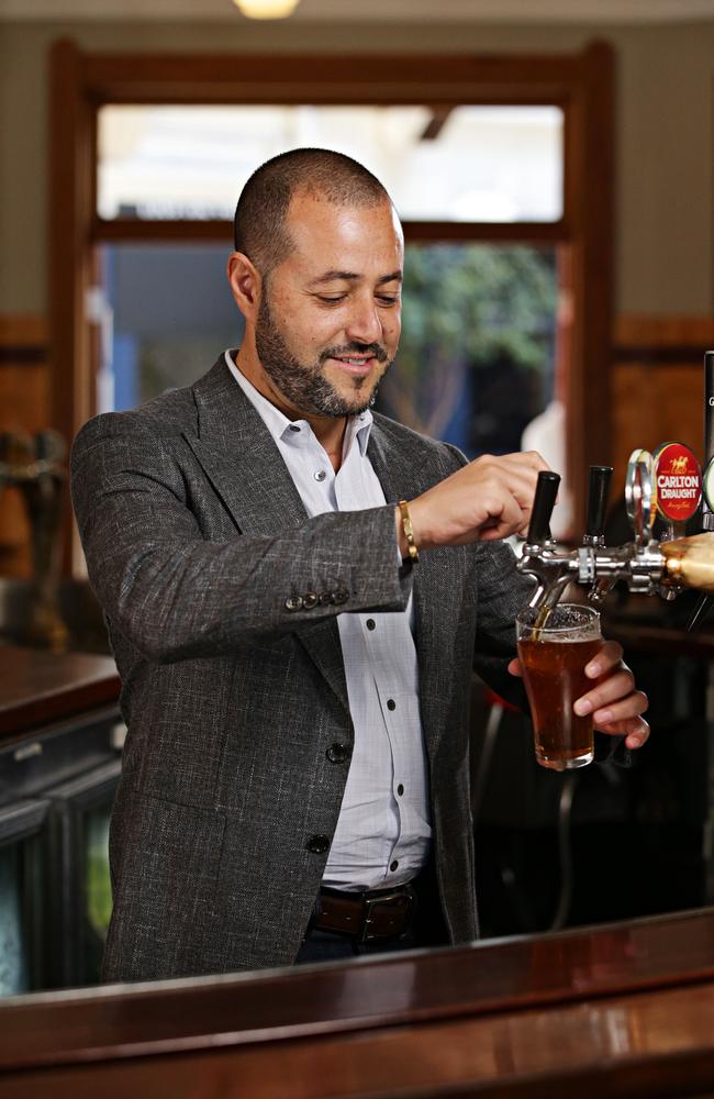 Sam Arnaout pours himself a beer at the Hotel Steyne. Picture: Adam Yip.