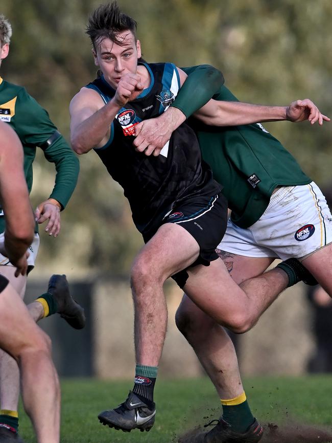 Jake Valvo gets a handball away for Laurimar. Picture: Andy Brownbill