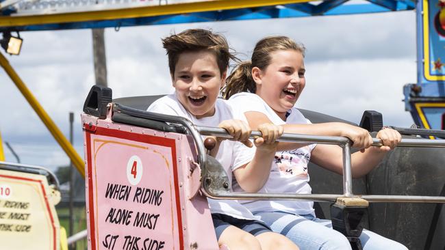 Oscar, 8, and Olivia Antifiliotis, 10, enjoy the rides at the Luddenham Show. Picture: AAP/Matthew Vasilescu