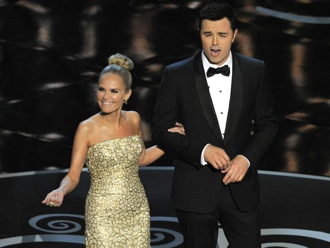 Kristin Chenoweth, pictured with 2013 Oscars host Seth MacFarlane, required several costume changes throughout the 2013 Academy Awards. Picture: Chris Pizzello/Invision/AP