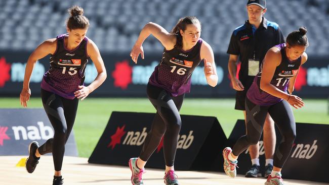 Jasmyn Hewett and Jessica Allan take part in the Yo-Yo run during the AFLW Draft Combine at Etihad Stadium. Picture: Michael Dodge/Getty Images