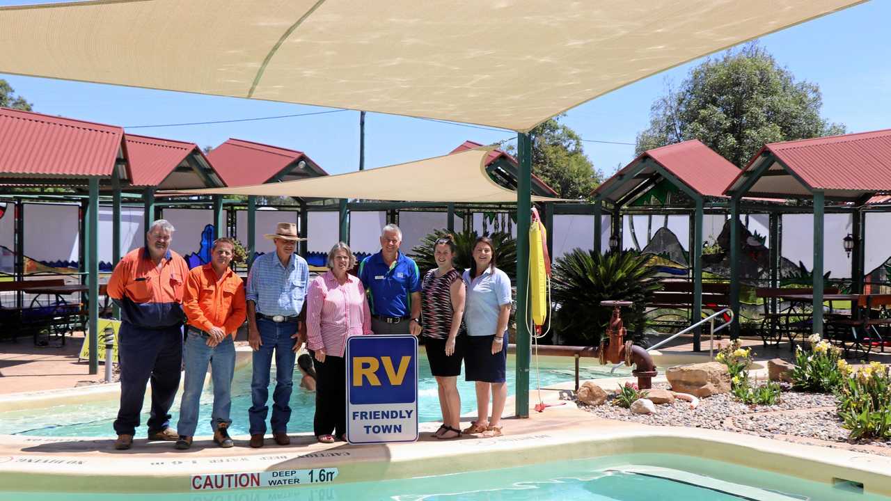 Maranoa Regional Council Deputy Mayor Jan Chambers and  Campervan and Motorhomes Club of Australia director Richard Mainey declare Mitchell RV friendly. (From left) John Tate, Darren Kay, Jeff Watson, Cr Chambers, Mr Mainey, Bree Jiggins and Jane Fenton,. Picture: Maranoa Regional Council