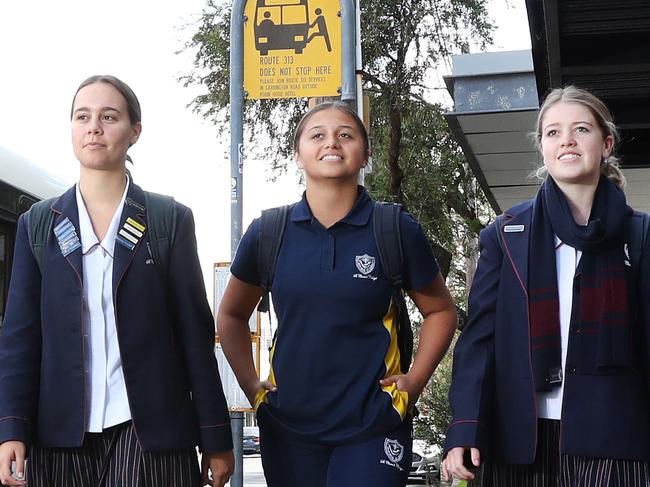 Pictured are St Clare's College Waverley students Grace Barker, Te Amohia McGlone and Amy McDiarmid.Important bus services that include stops servicing the school are to be axed.Picture: Richard Dobson