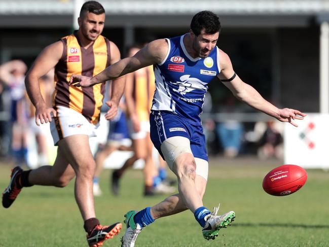 Michael O'Dea gets a kick away for Coburg Districts.