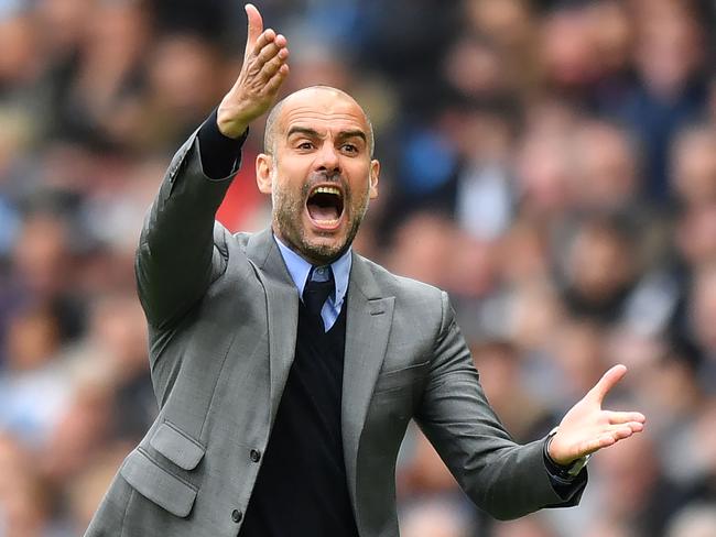 Manchester City's Spanish manager Pep Guardiola gestures on the touchline during the English Premier League football match between Manchester City and Leicester City at the Etihad Stadium in Manchester, north west England, on May 13, 2017. Manchester City won the game 2-1. / AFP PHOTO / Anthony DEVLIN / RESTRICTED TO EDITORIAL USE. No use with unauthorized audio, video, data, fixture lists, club/league logos or 'live' services. Online in-match use limited to 75 images, no video emulation. No use in betting, games or single club/league/player publications.  /