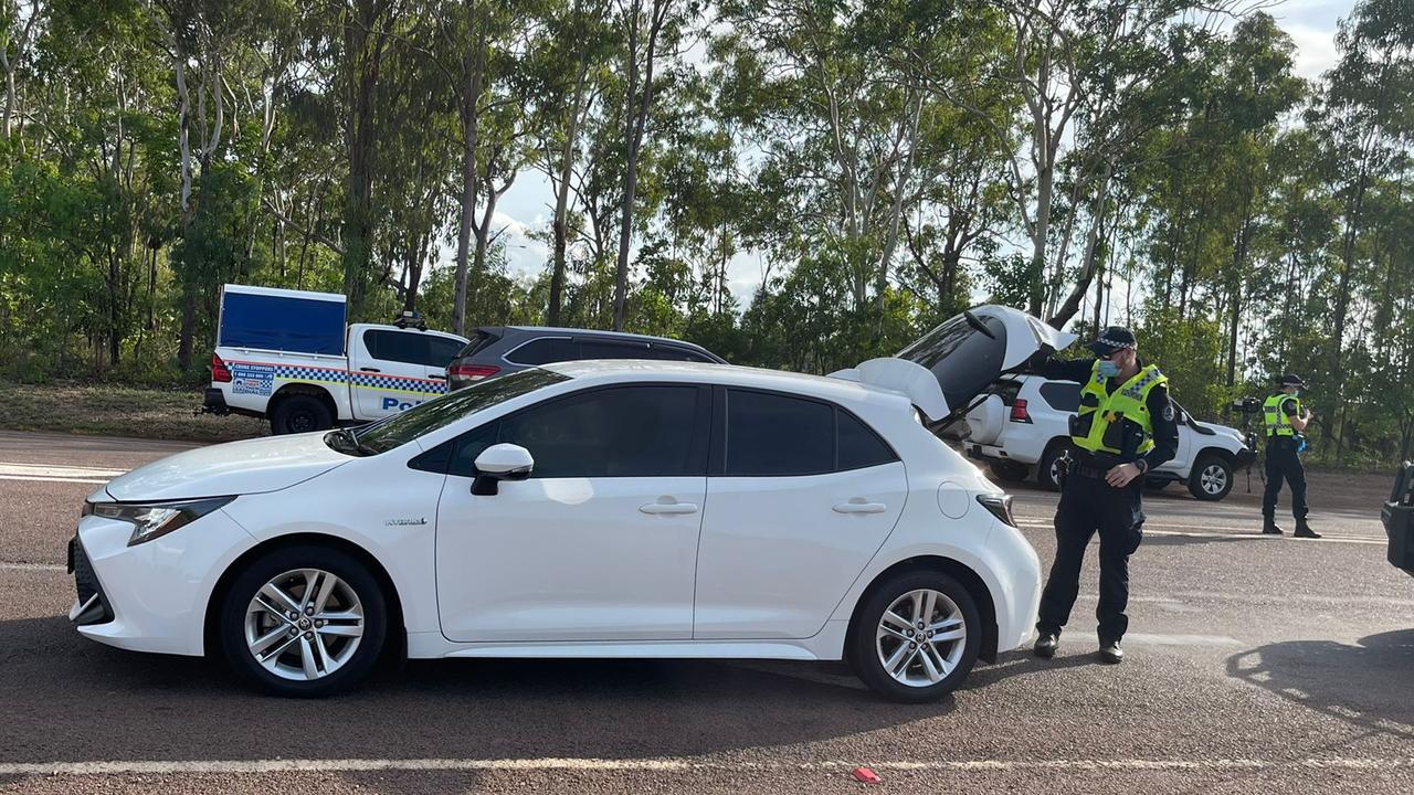 NT Police conduct vehicle checks after reports multiple people broke out of the Howard Springs quarantine facility in the early hours of Wednesday morning. Picture: Amanda Parkinson