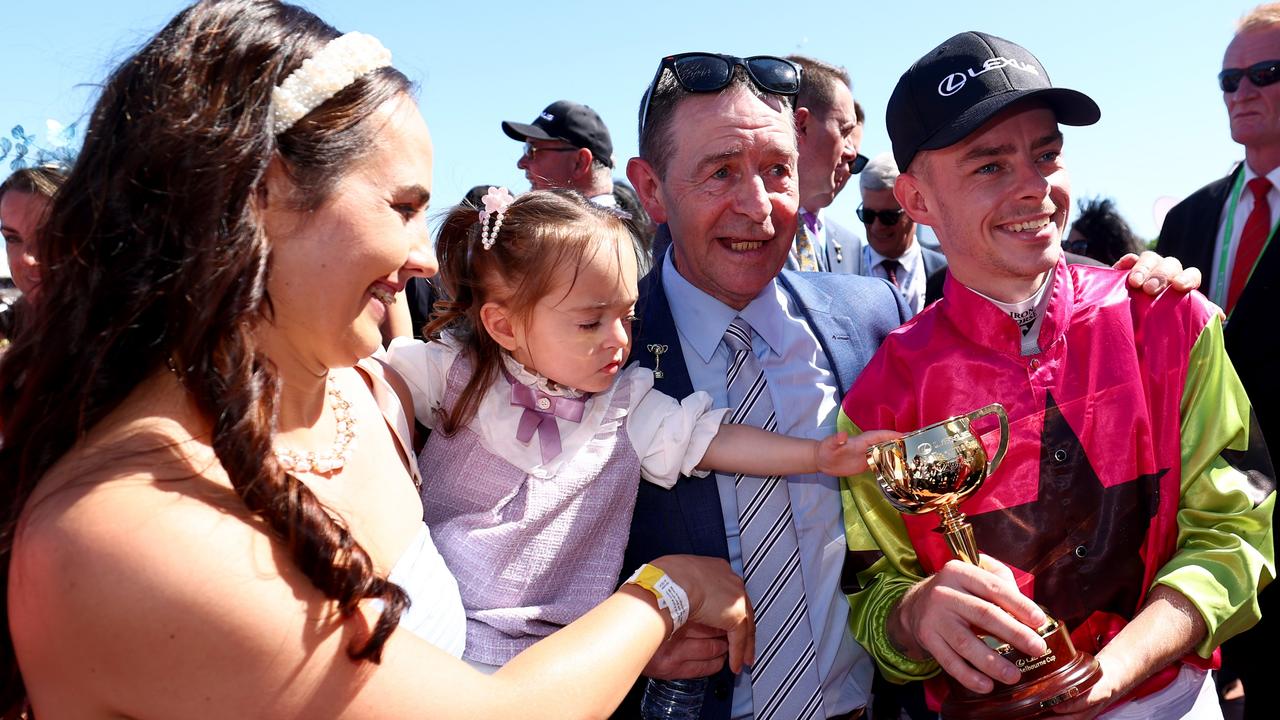 Dolan celebrates with partner Christine Duffy, daughter Maisie and dad Boddy. Picture: Josh Chadwick/Getty Images