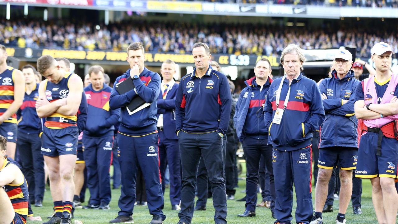 Don Pyke and the Crows squad watch Richmond’s medal presentation after the 2017 grand final. Picture Sarah Reed