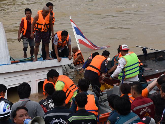 Thai rescuers work to help survivors of a capsized ferry. Picture: AFP/Daily News