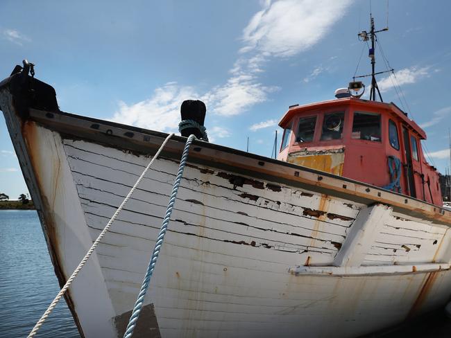 Craig Bellgrove with wooden boat Goondooloo that has been salvaged from the Tamar River to be restored in Hobart.  Picture: Nikki Davis-Jones