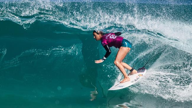 Sally Fitzgibbons beat Carissa Moore to take the lead on the world tour.