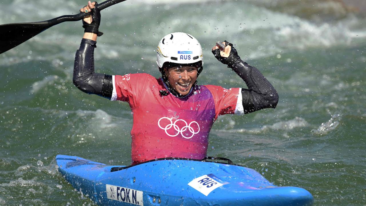 Australia's Noemie Fox celebrates winning the women’s kayak cross. (Photo by Bertrand GUAY / AFP)