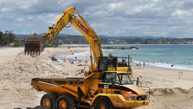 Diggers at Greenmount beach. Picture Glenn Hampson