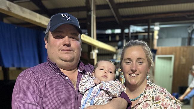 Crystal Bell, with four-month-old daughter Eva and partner Geordie Elliott. The new mother has recently been awarded an international title for her Murray Grey stud stock. Picture: Supplied.