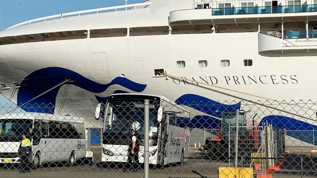 Bus drivers await as the cruise ship Grand Princess arrives in Adelaide with passengers suffering Covid aboard. Picture: Eva Blandis