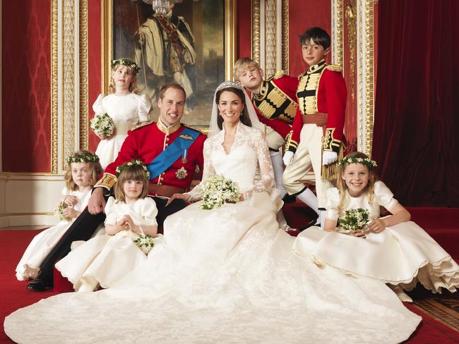 The bride and groom Prince William, Duke of Cambridge and Catherine, Duchess of Cambridge pose for an official photo with (clockwise from bottom right) The Hon. Margarita Armstrong-Jones, Miss Eliza Lopes, Miss Grace van Cutsem, Lady Louise Windsor, Master Tom Pettifer, Master William Lowther-Pinkerton, in the throne room at Buckingham Palace. Picture: Getty