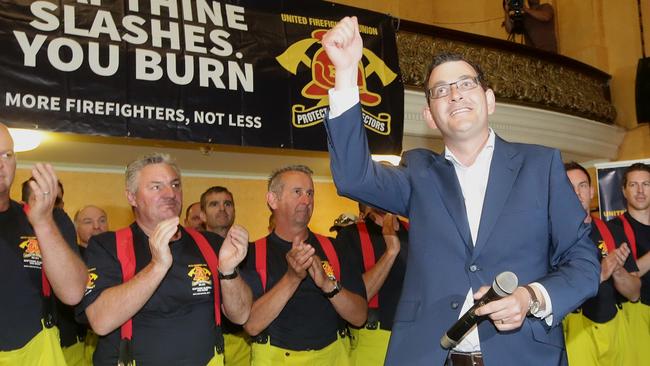 Daniel Andrews campaigning with firefighters at Collingwood Town Hall in late 2014. Picture: Hamish Blair