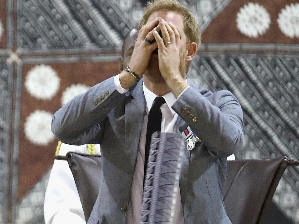 Bula! Prince Harry drinks the traditional Fijian drink of kava at the official welcome ceremony in Suva. Picture: Chris Jackson