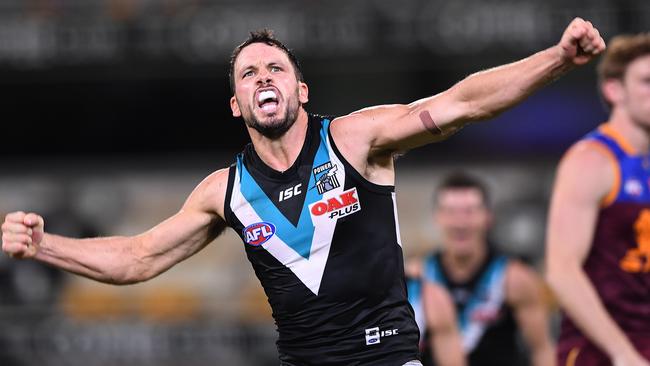 Travis Boak of the Power reacts after kicking a goal during the Round 3 clash with the Lions  at the Gabba. Picture: AAP Image/Dave Hunt