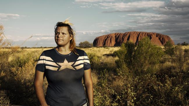 Wanatjura Patterson at Uluru: ‘I feel alive out here. I can breathe. Every time I drive off from this place I cry. It pulls me’. Picture: Justine Walpole