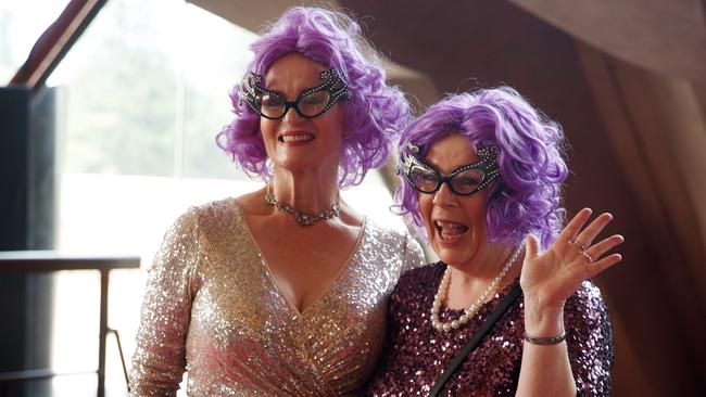 The purple wigs and cat eye glasses worn by Dame Edna were a hit with attendees. Picture: NCA NewsWire / Nikki Short