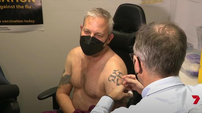 Victorian chief health officer Brett Sutton showed off his tattoos while receiving his flu vaccination. Supplied