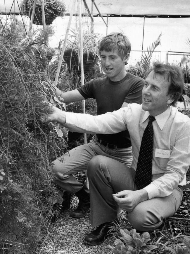 Lamb with trainee nurseryman John Amato at Goodwill Garden Centre, Dry Creek in 1981.