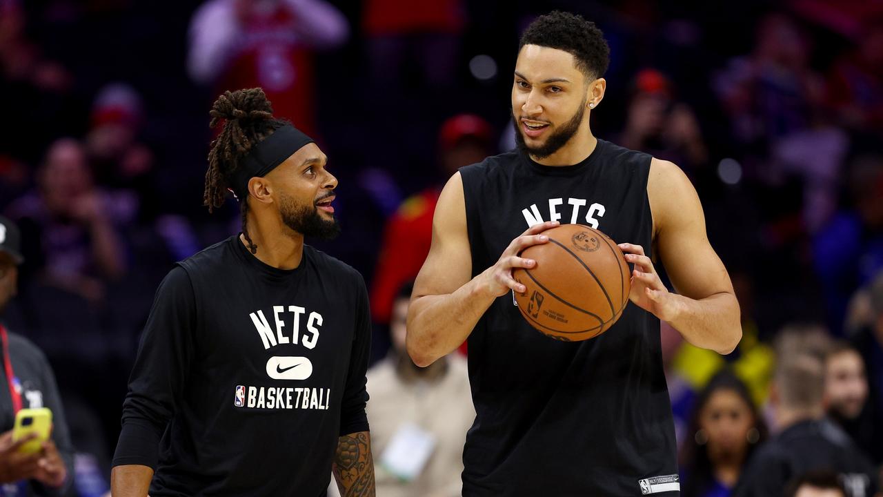Mills (L) and Simmons (R). (Photo by Elsa/Getty Images)