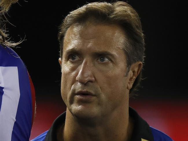 MELBOURNE, AUSTRALIA - MARCH 08: Bulldogs head coach Luke Beveridge speaks to his players during the AFL Community Series match between the Western Bulldogs and the Melbourne Demons at Marvel Stadium on March 08, 2021 in Melbourne, Australia. (Photo by Daniel Pockett/Getty Images)