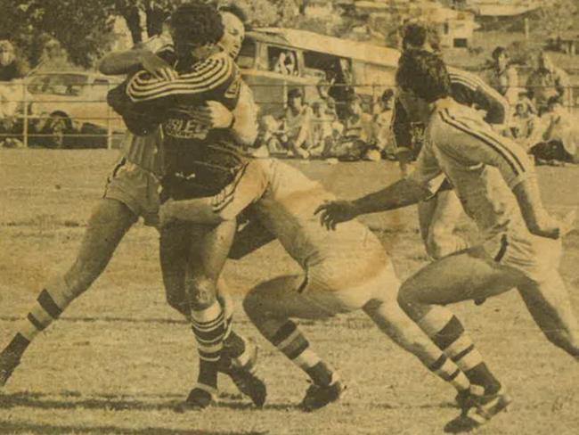 Lower Clarence centre Stephen Laurie is tackled high by Ballina centre Grant Anderson in the 1984 Group 1 Rugby League preliminary final 23-17 win at McKittrick Park, South Grafton. Going underneath the rugged centre is Anderson's centre partner Col Wisemantle.